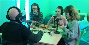 young people at the youth council around a table 